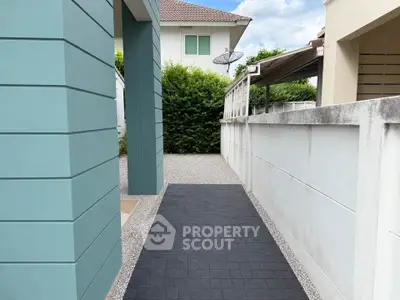 Modern exterior walkway with sleek design and greenery, perfect for contemporary homes.