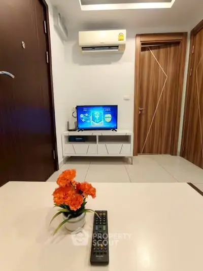 Modern living room with sleek furniture and air conditioning, perfect for cozy relaxation.