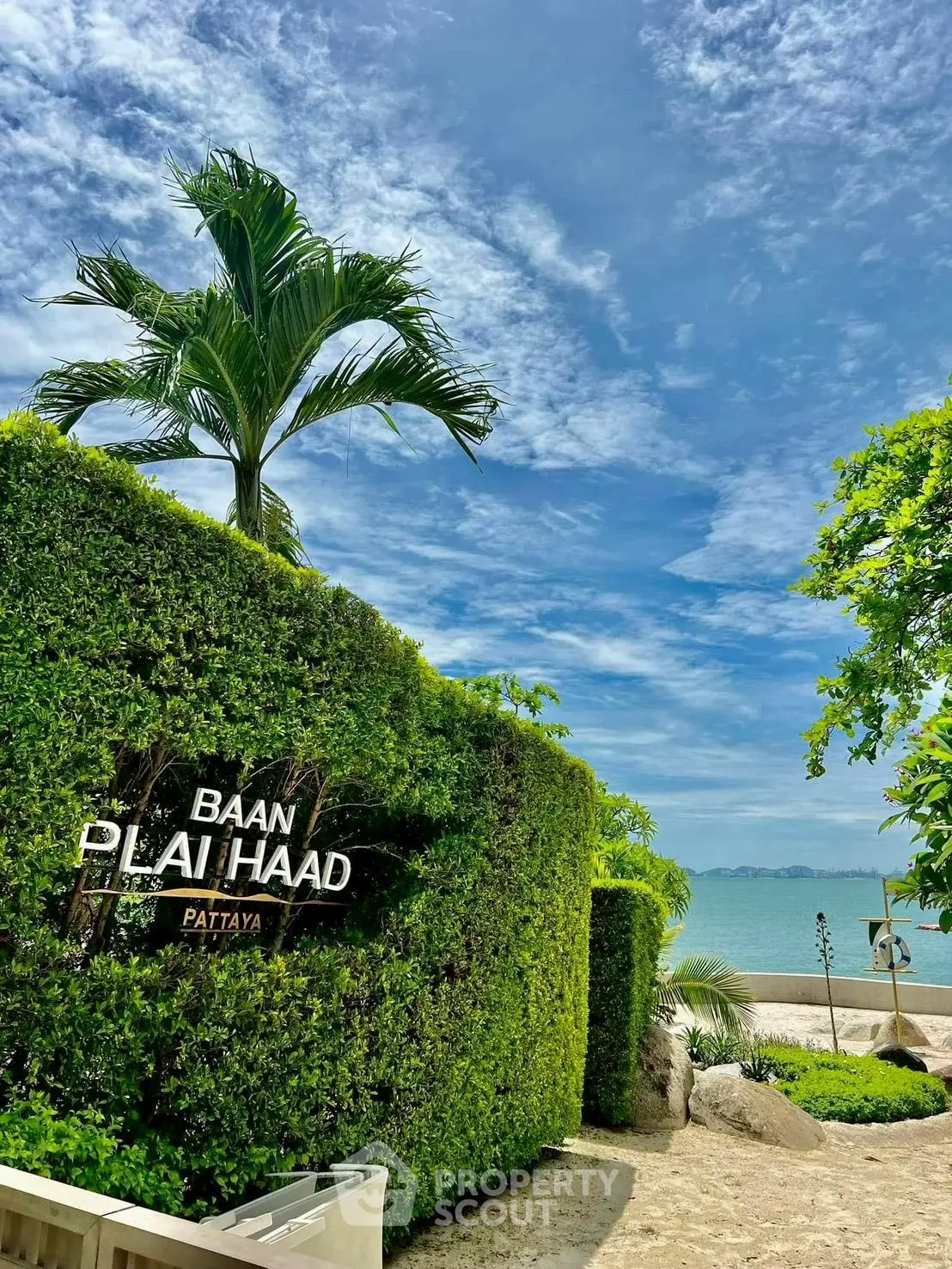 Luxurious beachfront property with lush greenery and stunning ocean view in Pattaya.
