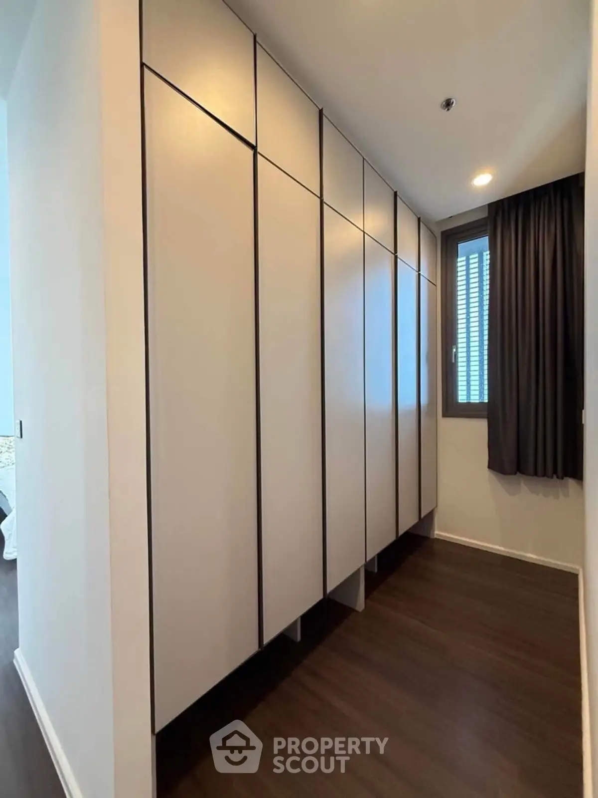 Spacious modern storage area with sleek cabinets and natural light
