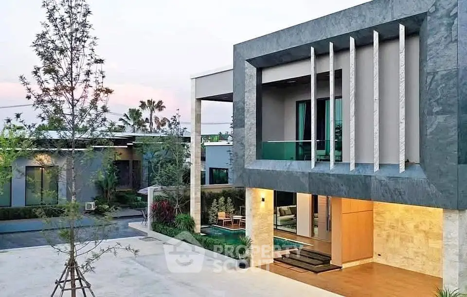 Modern luxury home exterior with sleek design and spacious outdoor area.
