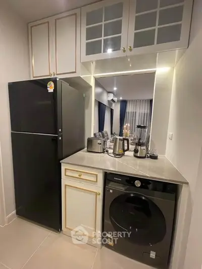 Modern kitchen with sleek appliances and ample storage space