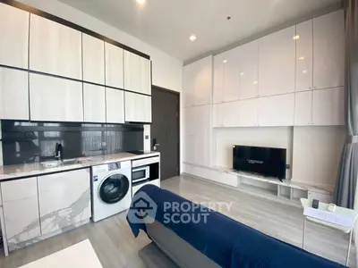 Modern living room with sleek cabinetry and built-in appliances
