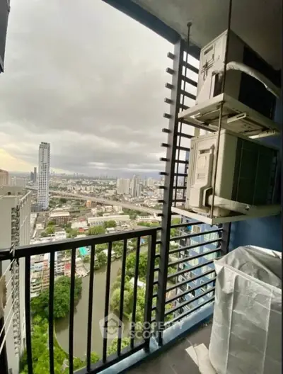 Stunning high-rise balcony view overlooking cityscape and river, perfect for urban living enthusiasts.