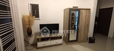 Cozy living room with modern TV stand and stylish wardrobe