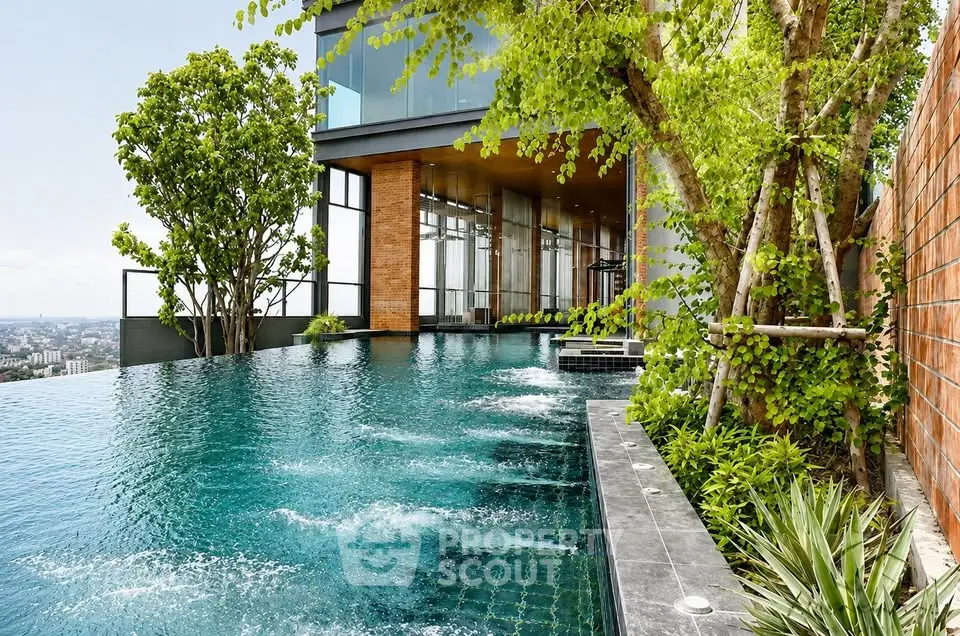 Luxurious rooftop infinity pool with stunning city views and lush greenery.