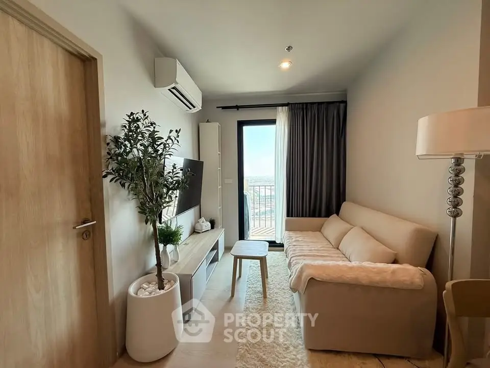 Modern living room with cozy sofa, TV, and balcony view in stylish apartment.