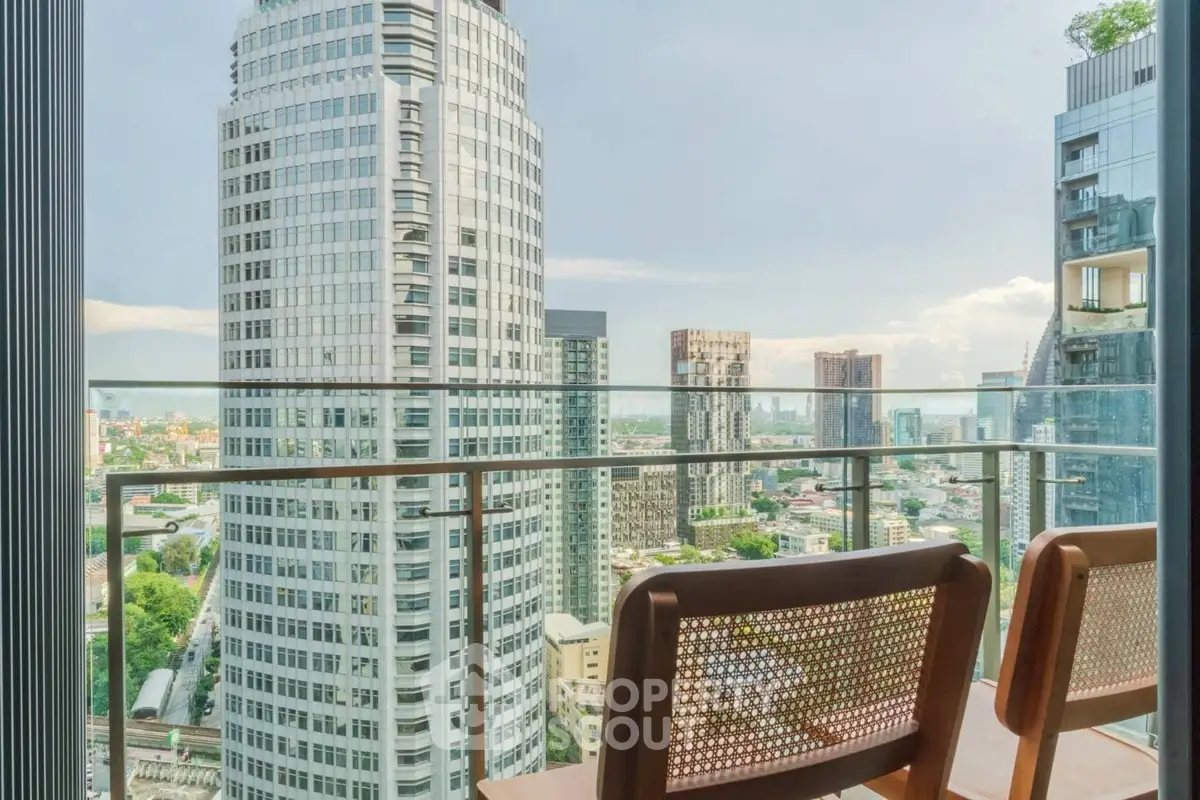 Stunning cityscape view from a modern balcony with stylish seating, perfect for urban living.