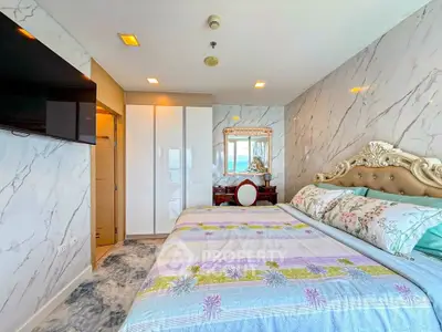 Luxurious bedroom with elegant decor and marble walls in modern apartment