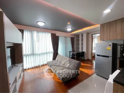 Modern living room with stylish furniture and natural light in a contemporary apartment.