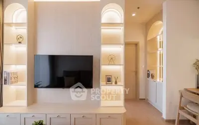 Modern living room with sleek TV setup and elegant shelving