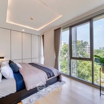 Luxurious bedroom with floor-to-ceiling windows and stunning greenery view.