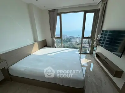 Luxurious bedroom with stunning ocean view and modern amenities