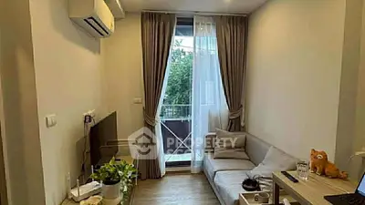 Cozy living room with balcony access and modern decor