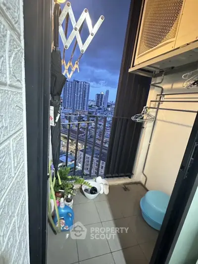 Charming balcony with city view, perfect for relaxing evenings in urban setting.