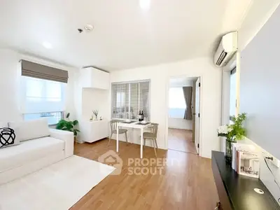 Bright and modern living room with wooden flooring and stylish decor