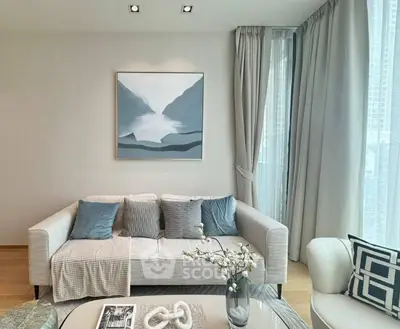 Elegant living room with plush seating, serene color palette, and tasteful art, perfect for relaxation and entertaining guests in style.