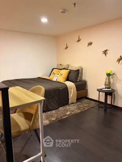 Cozy bedroom with modern decor and stylish furnishings, perfect for a comfortable living experience.