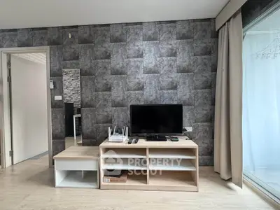 Modern living room with stylish TV stand and textured wall design