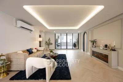 Spacious modern living room with elegant lighting and cozy seating area