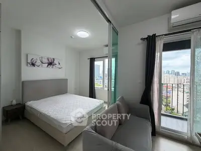 Modern bedroom with balcony view in high-rise apartment