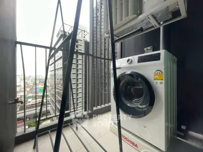 Modern balcony with washing machine and city view, perfect for urban living.