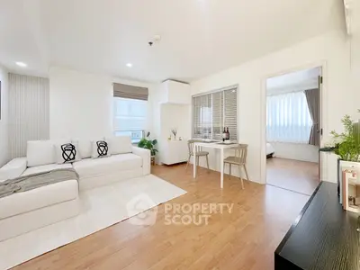 Spacious modern living room with cozy decor and natural light