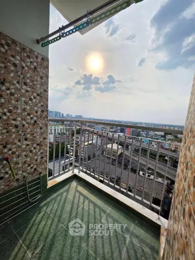 Stunning balcony view with cityscape and sunset, perfect for relaxation and enjoying urban living.