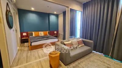 Modern bedroom with cozy seating area and stylish decor