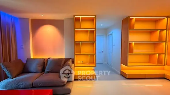 Modern living room with stylish lighting and cozy sofa in contemporary apartment.