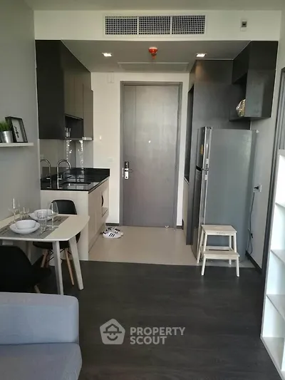 Modern apartment interior with sleek kitchen and dining area