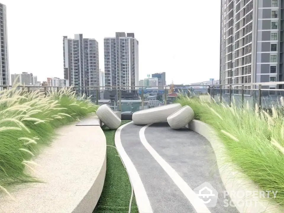 Modern rooftop garden with city skyline view and stylish seating