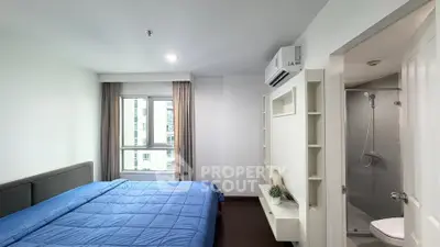 Modern bedroom with ensuite bathroom in a stylish apartment