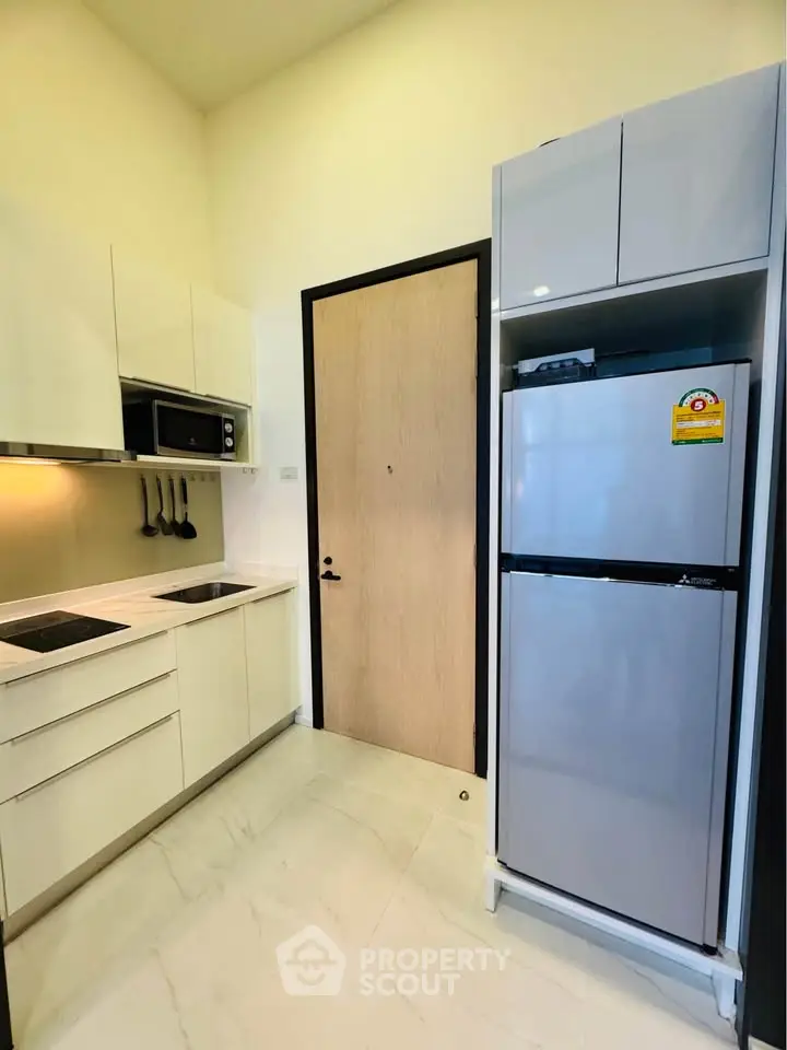 Modern kitchen with sleek appliances and minimalist design