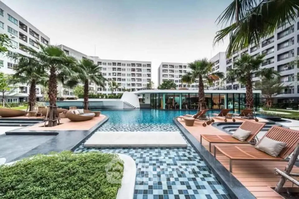 Luxurious condominium with stunning pool and lush landscaping, perfect for modern living.