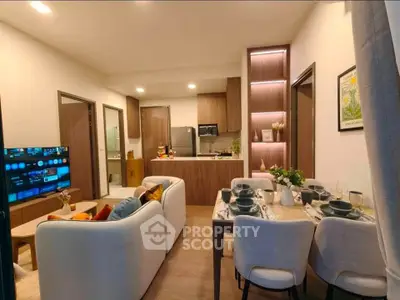 Modern open-layout living room with cozy seating and stylish dining area, perfect for entertaining.