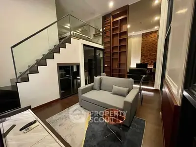 Modern living room with stylish staircase and cozy seating area