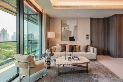 Luxurious modern living room with city view and elegant decor.