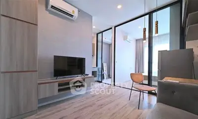 Modern living room with sleek design and large windows for natural light.