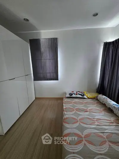 Cozy bedroom with modern wardrobe and natural light