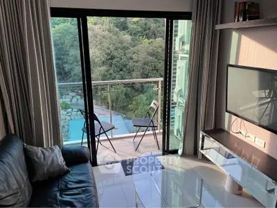 Modern living room with balcony and scenic view, featuring sleek furniture and natural light.
