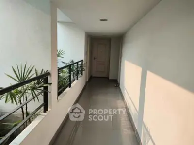 Bright corridor with modern design and natural light in residential building