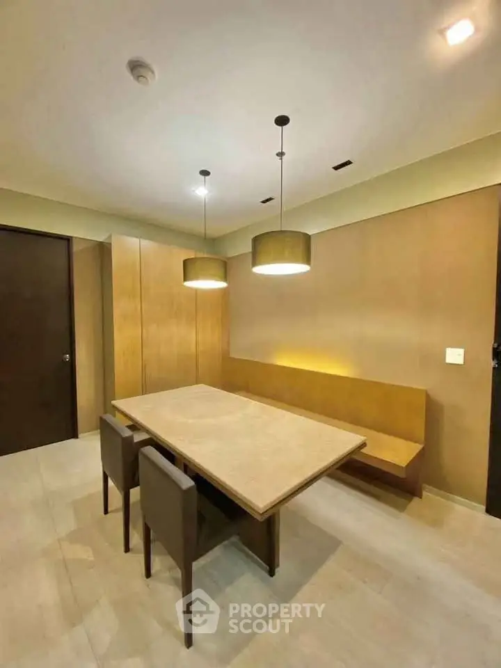 Modern dining area with elegant lighting and minimalist design