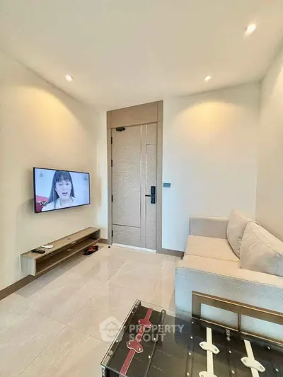 Modern living room with sleek TV setup and stylish furniture