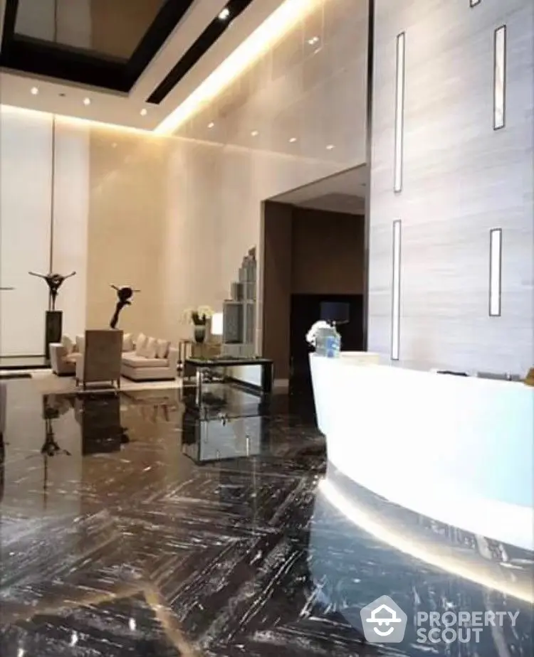 Luxurious high-ceiling living room with polished marble floors, modern furniture, and elegant lighting fixtures creating an opulent atmosphere.