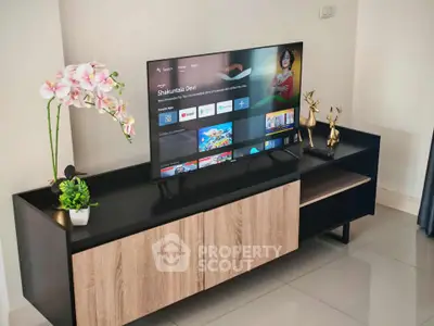 Modern living room with sleek TV stand and decorative accents