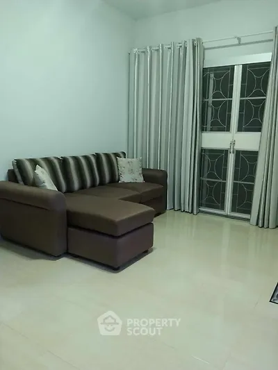 Cozy living room with modern sofa and elegant curtains