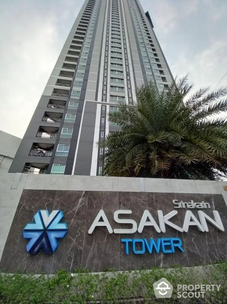 Stunning high-rise Asakan Tower with modern architecture and lush greenery