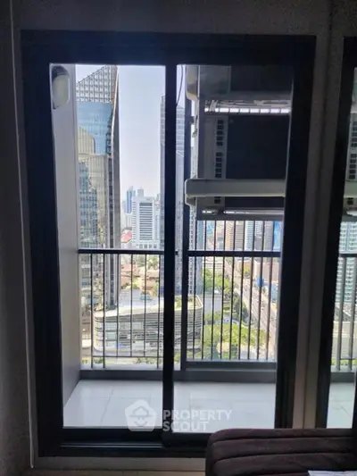 Stunning cityscape view from a modern high-rise apartment balcony, perfect for urban living enthusiasts.