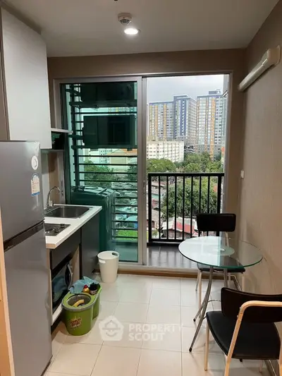 Modern kitchen with balcony view in urban apartment